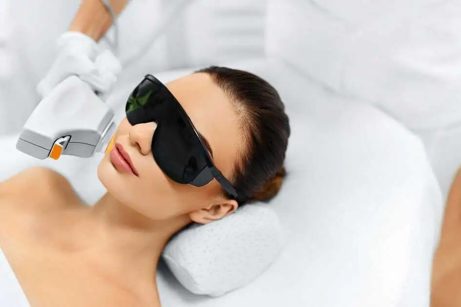 A woman receiving an IPL photofacial treatment in Miramar Beach, FL